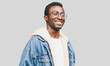 © guas - Portrait of happy smiling african man looking away wearing an eyeglasses on a gray background