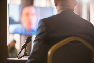 businessmen having a discussion via videolink