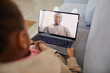 © Seventyfour - High angle view at African-American girl talking to dad via video chat while social distancing, copy space