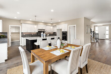 Kitchen, Dining Room, And Entrance In New Luxury Home With Open Concept Floor Plan