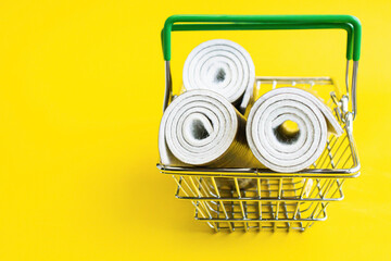 Wall Mural - Linoleum in a shopping basket. Linoleum purchased. Basket with linoleum.