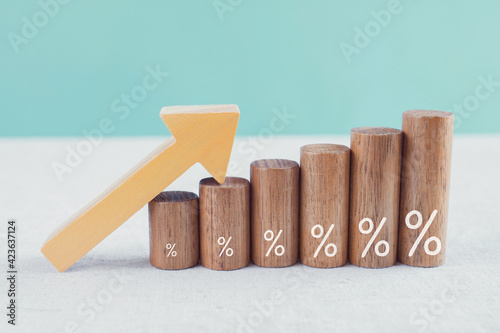 Obraz Dibond Wooden blocks with percentage sign and arrow up, financial growth, interest rate and mortgate rate increase, inflation concept