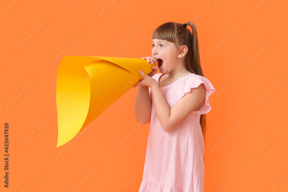 Little girl with creative megaphone on color background