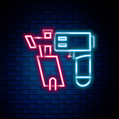 Wall Mural - Glowing neon line Nail gun icon isolated on brick wall background. Colorful outline concept. Vector