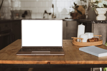 Laptop on rustic wood table in kitchen room. for display montage.