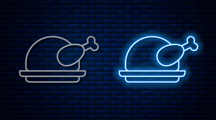 Wall Mural - Glowing neon line Roasted turkey or chicken icon isolated on brick wall background. Vector