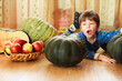 © alexkich - Little child choose a pumpkin at autumn. Child sitting on giant pumpkin. Pumpkin is traditional vegetable used on American holidays - Halloween and Thanksgiving Day.