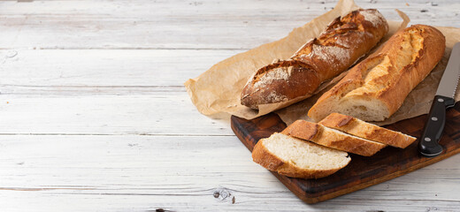 Canvas Print - baked bread on wooden table