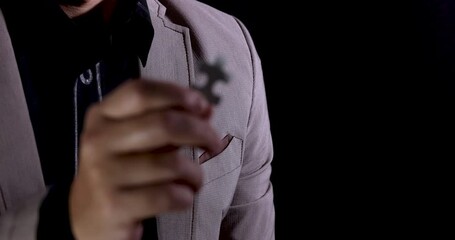 Poster - Slow Motion 4K Video close up businessman show jigsaw piece in hand. Concept for business strategy and marketing plan.