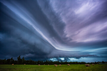 Supercell storm clouds with wall cloud and intense rain