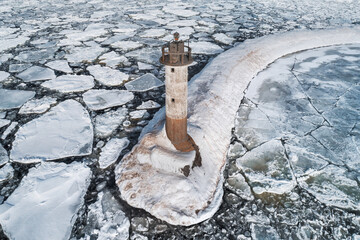 Vuokhensalo lighthouse in the ice of the Ladoga lake, Leningrad region, Russia