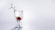 © Maizal - The strawberry falls into a glass of water