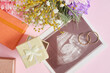 © Natasha - ultrasound shot on pink background, flowers and gift box for decor, pregnancy and motherhood concept, conscious parenthood