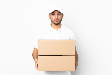 Delivery Arabian man isolated on blue background keeping arms crossed