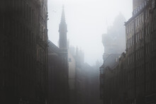 Haunting, Spooky And Moody Atmospheric Old Town Edinburgh Along The Medieval Royal Mile In Misty Fog.