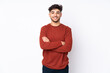 © luismolinero - Arabian handsome man over isolated background keeping the arms crossed in frontal position