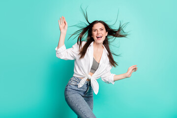 Sticker - Photo of positive cheerful happy young woman fly hair look empty space isolated on pastel teal color background