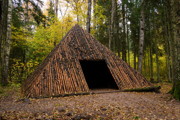 Pyramid of Wishes. Wooden pyramid in the mysterious Pokaini Forest near Dobele, Latvia during cloudy autumn day