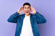 © luismolinero - Teenager caucasian  handsome man isolated on purple background with surprise expression