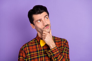 Sticker - Photo of minded pensive guy finger chin look empty space wear bow tie checkered shirt isolated purple background