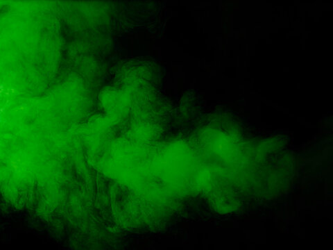 Fototapete - Green smoke on black background