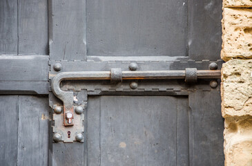 lockdown, ancient metal lock of ancient wooden door