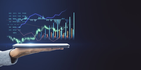 Poster - Profitable investment concept with digital tablet on human hand with virtual interface with growing diagram and candlestick on dark blank backdrop. Mock up
