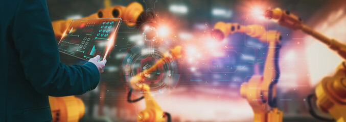 Wall Mural - industry engineer construction,using smart tablet,control automation robot arm machine intelligence 