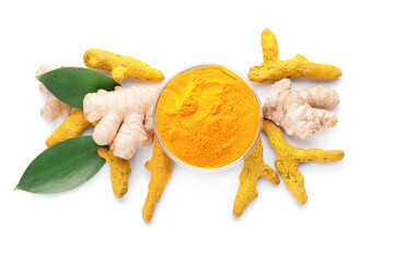 Bowl with turmeric powder and roots on white background