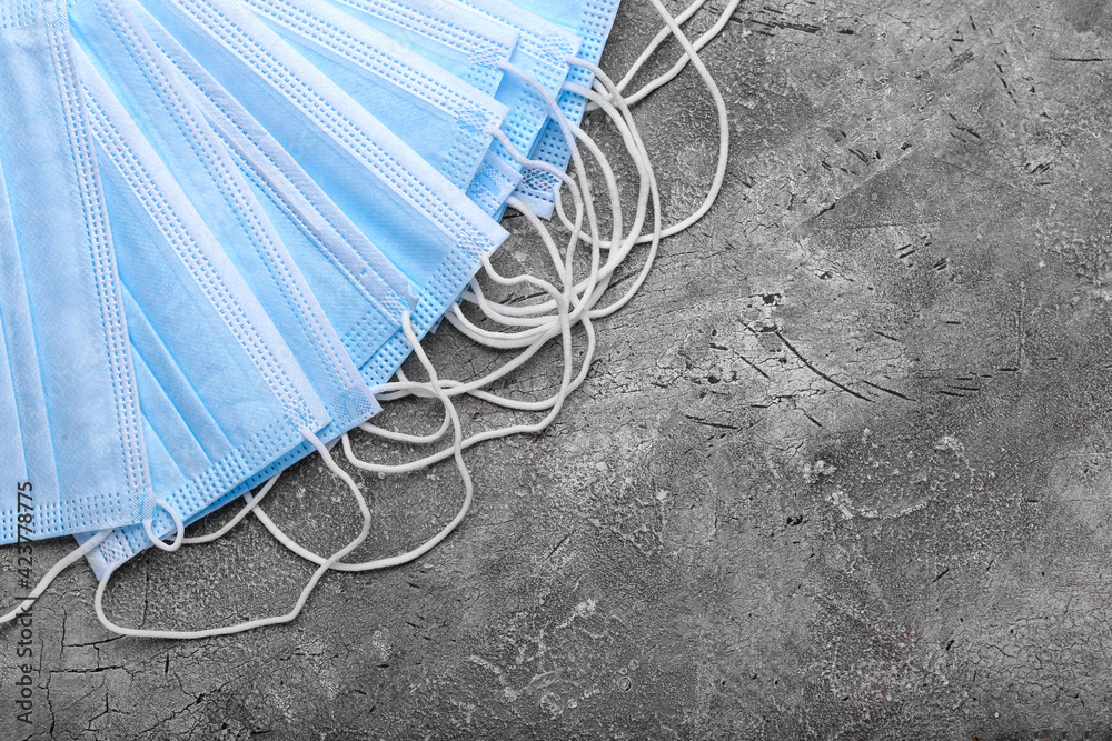 Medical masks on grey background