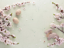 Easter Photo. Blooming Branch, Handmade Hare And Eggs On A Light Background