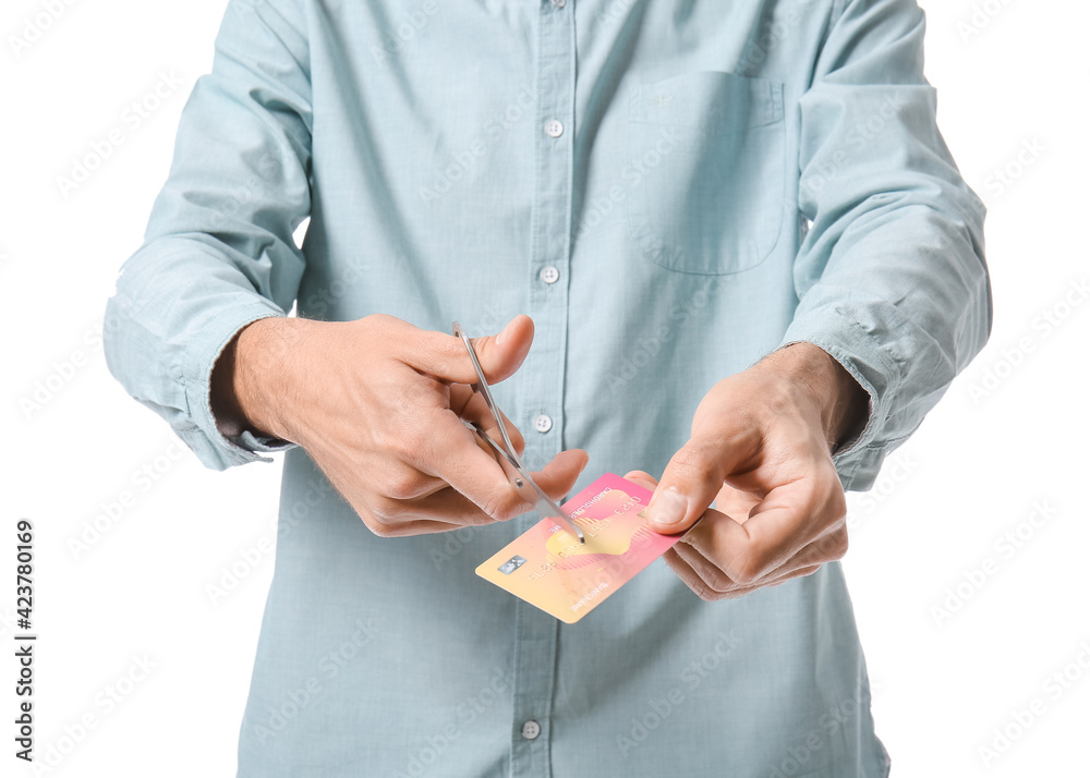 Man cutting his credit card on white background. Bankruptcy concept