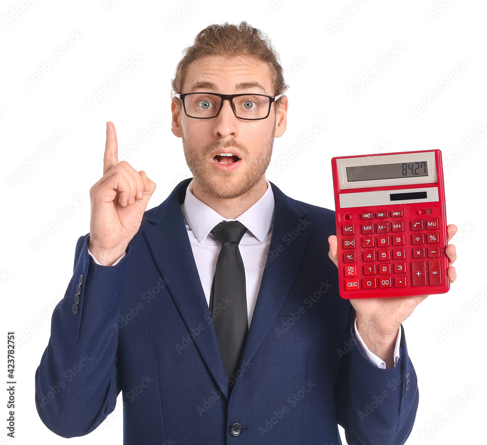 Shocked businessman with calculator and raised index finger on white background