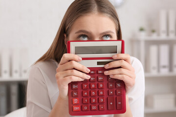 Sticker - Stressed female accountant with calculator working in office