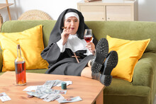 Senior Nun With Cigar And Alcohol At Home