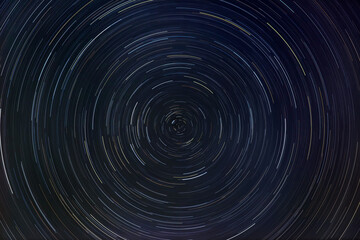 star trails rotation of bright stars at night around the polar star
