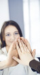 © Iryna - Business people group showing teamwork and joining hands or giving five in modern office. Unknown businessman and women making circle with their hands