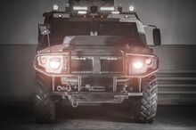 Image Of A Military Truck With Headlights And Lamps On. War Concept. Anti-terrorism.
