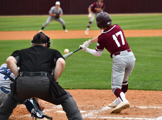 Wall Mural - Action photo of high school baseball players making amazing plays during a baseball game