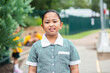© Clare Seibel-Barnes/Austockphoto - Happy smiling school girl wearing a dress