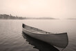 © Chris Hackett/Tetra Images - USA, New York, Santa Clara, Upper Saranac Lake, Empty canoe on Upper Saranac Lake