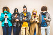 © Davide Angelini - Group of young people covered by face masks using smartphone mobile device - New normal concept with friends on social media - People and technology concept