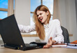 © SHOTPRIME STUDIO - business woman working desk laptop in office emotions dissatisfaction communication