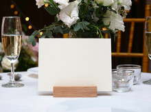 Mockup White Blank Space Card, For Greeting, Table Number, Wedding Invitation Template On Wedding Table Setting Background. With Clipping Path