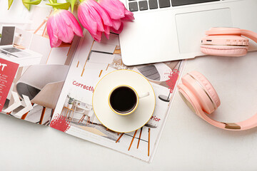 Sticker - Cup of coffee with flowers, laptop, magazine and headphones on white background