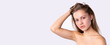 © Viorel - Banner- long format, white background. Blonde serious naked woman posing with hand in hair, looking at camera standing in studio. Female beauty portrait, youth, spa and wellness concept