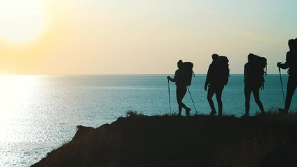 Wall Mural - the four travelers walking to the mountain cliff against the seascape