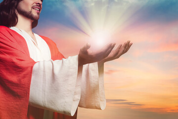 Poster - Jesus Christ reaching out his hands and praying at sunset