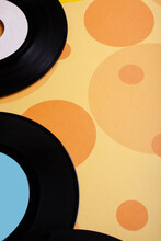 Old Vinyl 45 Rpm Records On Yellow Background