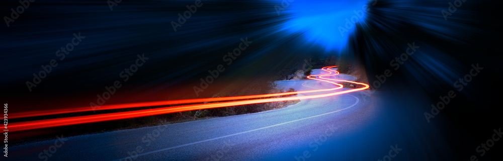 Cars light trails at night in a curve mountains road, panorama - obrazy, fototapety, plakaty 